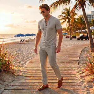 Men's summer casual lace-up short sleeve shirt and matching trousers set on a sunny beach