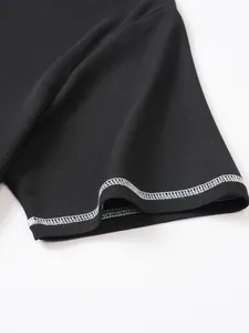 Close-up of men's black seersucker short sleeve with white contrast stitching