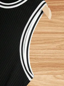 Close-up detail of a men's ribbed knit tank top featuring stylish contrast striped trim