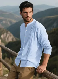 Men's light blue cotton linen shirt with band collar and pleated front detail.