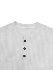 Detail view of a men's white corduroy Henley sweatshirt with buttons and ribbed texture.