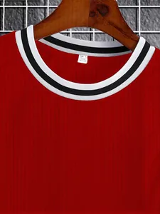 Close-up of men's red ribbed knitted vest showing colorblock striped neckline