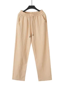 Vue de face d'un pantalon décontracté en lin beige pour homme avec taille élastiquée