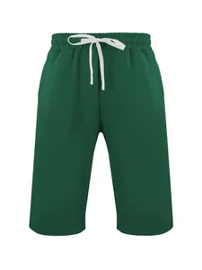 Vista frontale di pantaloncini hip-hop verde scuro da uomo con coulisse bianca.