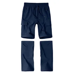Detail of navy blue detachable cargo pants with multi-pockets and drawstring waist.