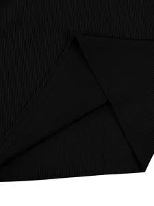 Detailed macro view of black ribbed texture and hem stitching on men's corduroy top