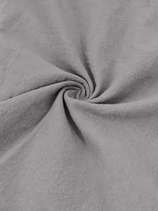 Macro detail shot showing the breathable texture of high-quality grey cotton linen fabric
