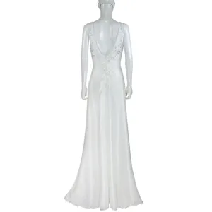 Detailed back view of an elegant white lace patchwork backless wedding gown for women