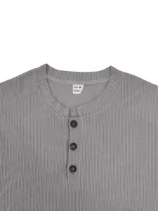 Close-up of grey corduroy sweatshirt neckline with three-button placket