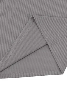 Macro close-up view of grey corduroy ribbed fabric texture and fine stitching