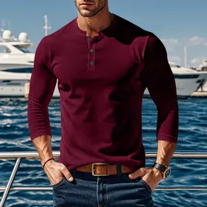 Detailed macro view of burgundy corduroy long sleeve Henley shirt with button neck design