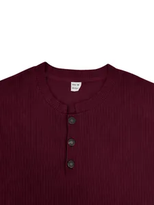 Close-up of burgundy ribbed henley shirt with collar tag and three-button detail