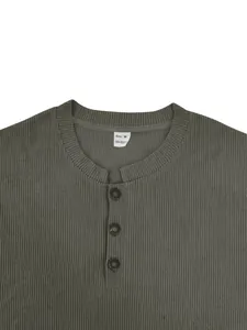 Detail of olive green men's corduroy Henley shirt showing buttons and ribbed texture