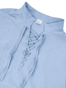 Close-up detail of light blue men's linen henley shirt with lace-up front