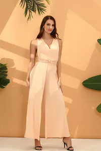 Full body view of an elegant peach multi-way wrap jumpsuit with wide leg silhouette.