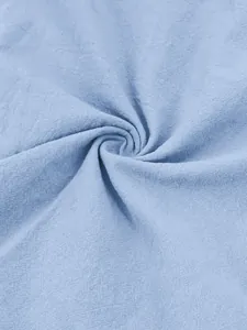 Close-up of breathable light blue cotton linen fabric texture
