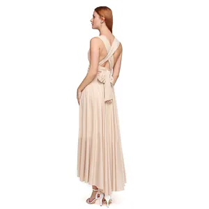 Back view of champagne multi-way infinity dress with high-low hem and cross straps