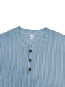 Close-up of light blue men's corduroy Henley sweatshirt with button collar detail.