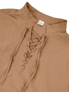 Close-up detail of men's brown linen lace-up henley shirt with a stylish stand collar