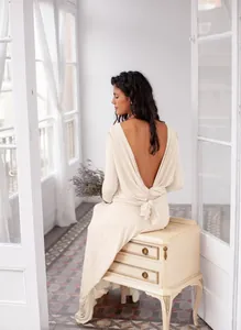 Elegant cream multi-way maxi dress featuring a sexy open back with twisted knot detail
