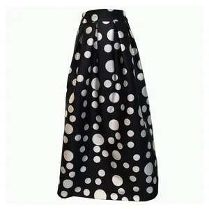 Vintage black and white polka dot high waist A-line midi skirt with pleated details.