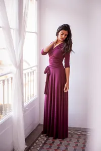 Detail view of elegant burgundy convertible dress with 3/4 sleeves and floor-length hem.