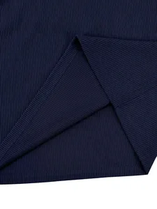 Close-up of the dark blue ribbed fabric and hem stitching on a men's sweatshirt.
