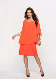 Detail of orange plus size chiffon dress with elegant two-piece overlay design