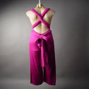 Fuchsia multi-way bandage jumpsuit back view showing the sexy cross strap design.