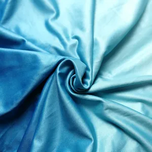 Detailed macro view of smooth blue gradient satin fabric for multi-way long dress