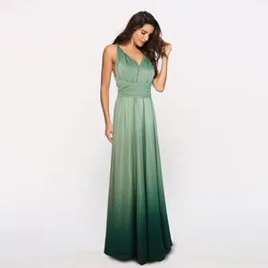 Elegant ombré green multi-way wrap maxi dress featuring a sexy cross-back design on model