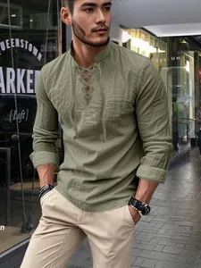 Men's olive green cotton linen Henley shirt with long sleeves and a lace-up neckline.