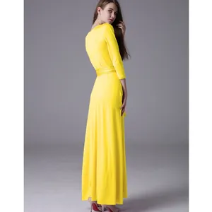 Elegant yellow floor-length bandage dress with 3/4 sleeves and multi-way wrap design