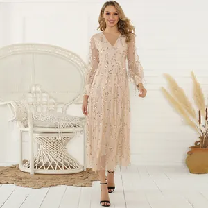Elegant champagne V-neck midi dress featuring sparkling gold sequins and fringe detail.
