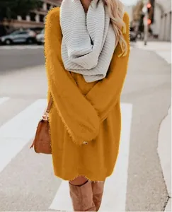 Close-up of a mustard yellow plush midi dress with a soft fuzzy texture for winter