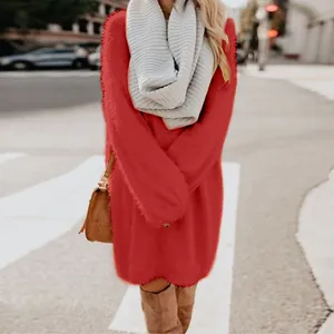 Cozy red long sleeve fuzzy sweater dress styled with a grey scarf in an urban setting.