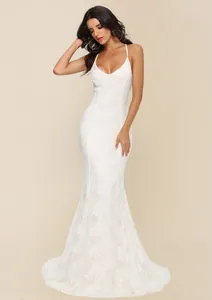 Elegant white lace floor-length wedding dress featuring a V-neckline and a long mermaid train