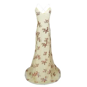 Full-length view of a sequin mesh evening gown with a backless criss-cross design