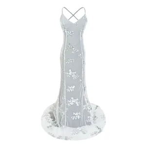 Elegant silver sequin mesh backless evening gown with fishtail train and cross-straps