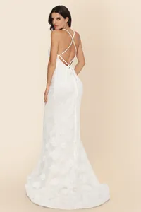 Elegant backless lace wedding dress with cross straps and long flowing train