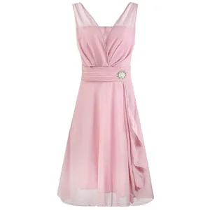 Detailed view of a pink chiffon sleeveless cocktail dress with ruffled skirt and brooch