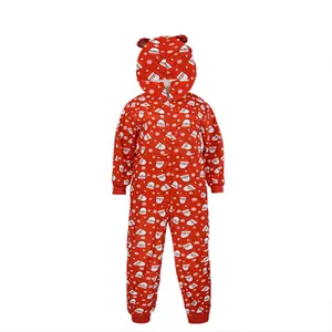 Close-up of a festive red Christmas onesie featuring Santa and snowflake prints.