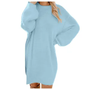 Detail of soft light blue plush fabric on a loose crew neck long sleeve sweater dress