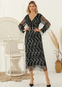 Elegant black V-neck dress with silver sequins and fringe detail for party wear