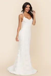 Elegant white lace wedding dress with a V-neck, spaghetti straps, and long train.