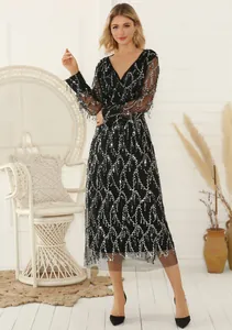 Full view of elegant black V-neck sequined evening dress featuring fringe details and mesh sleeves