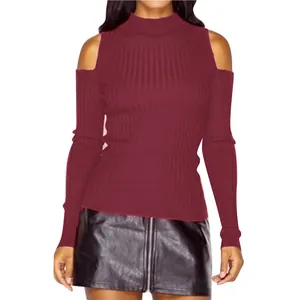 Detail view of a burgundy cold-shoulder high-neck ribbed knit sweater on a model.