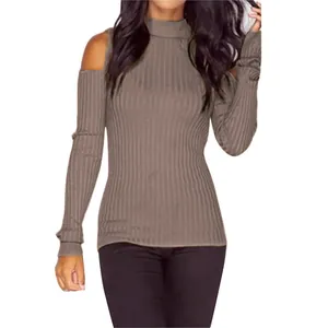 Close-up detail of women's elegant cold-shoulder ribbed knit turtleneck sweater in taupe