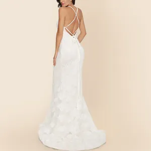 Elegant white lace wedding gown with sexy backless design and a long sweeping train.