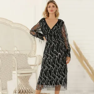 Elegant black V-neck midi party dress decorated with silver sequins and flowing fringe tassels